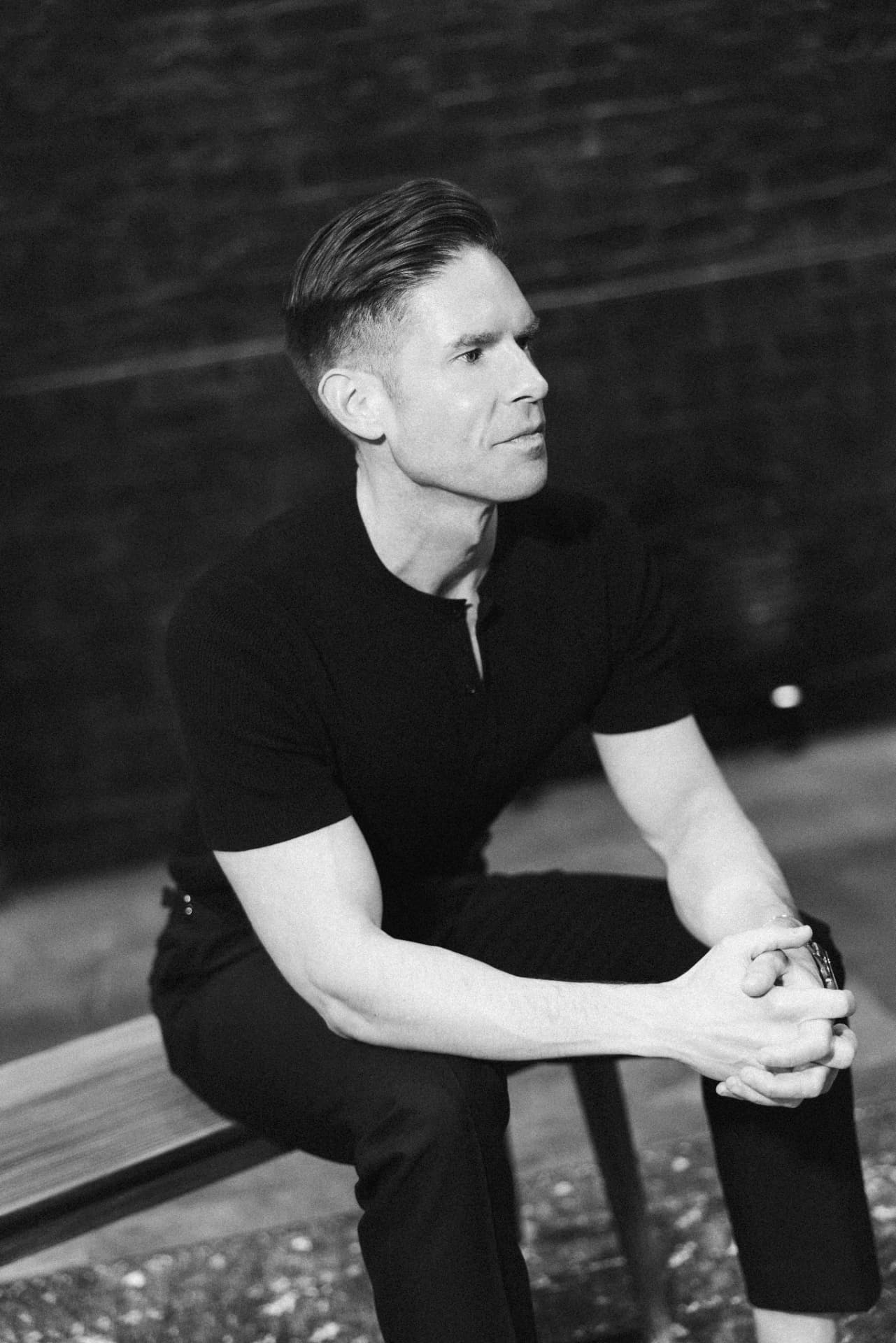 Frank DiLella seated, backstage portrait