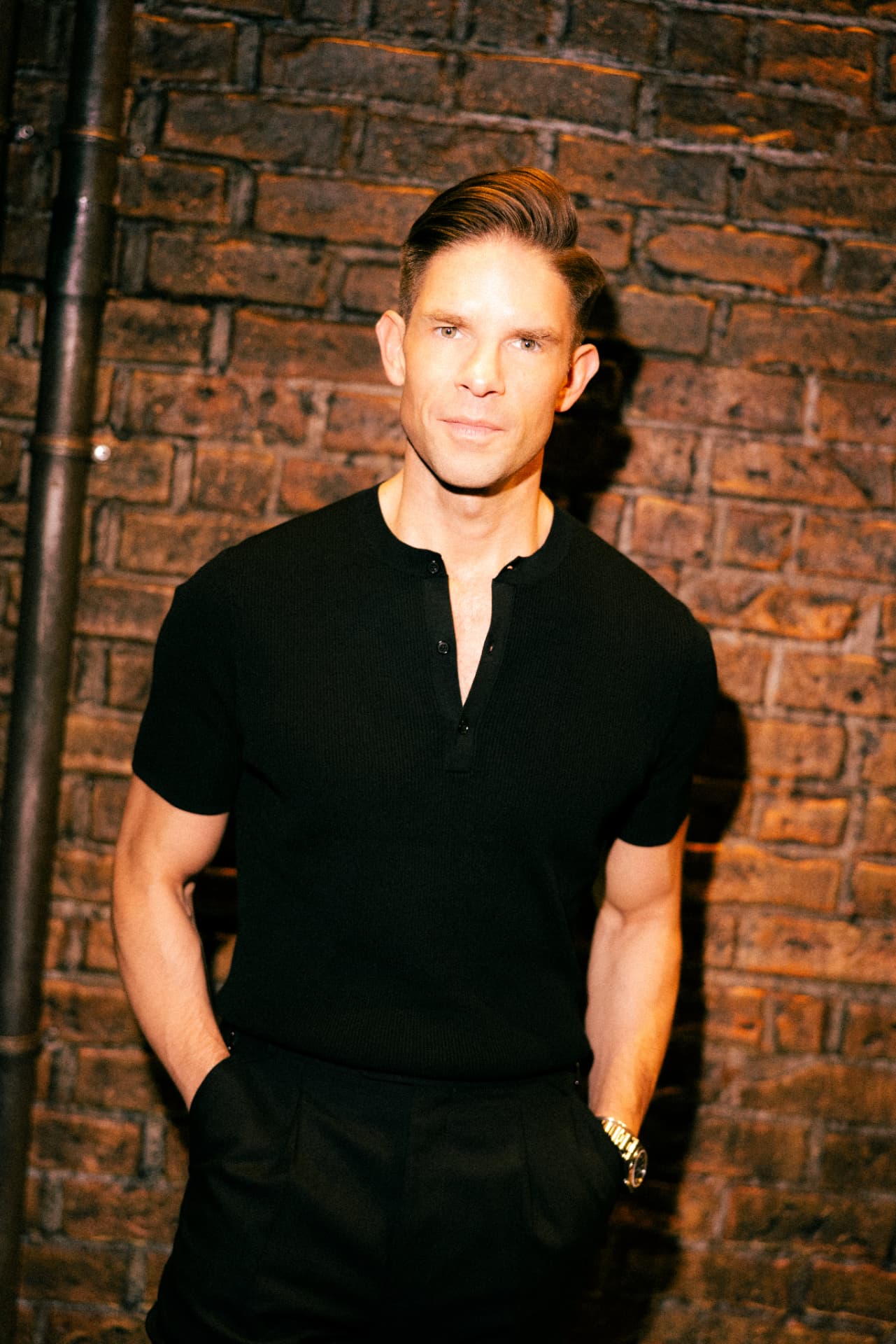 Frank DiLella against a brick wall